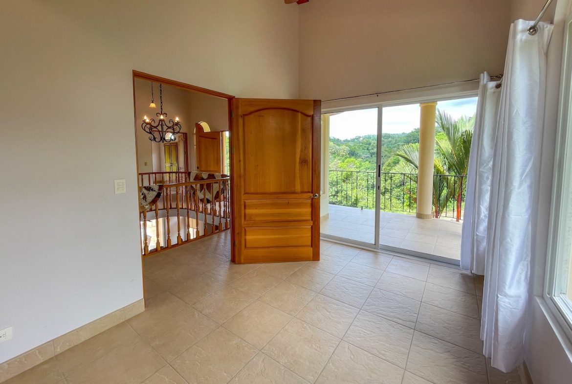 SOLID CONSTRUCTION HOME WITH BEAUFITUL JUNGLE VIEWS IN OJOCHAL – 0.36 ACRES