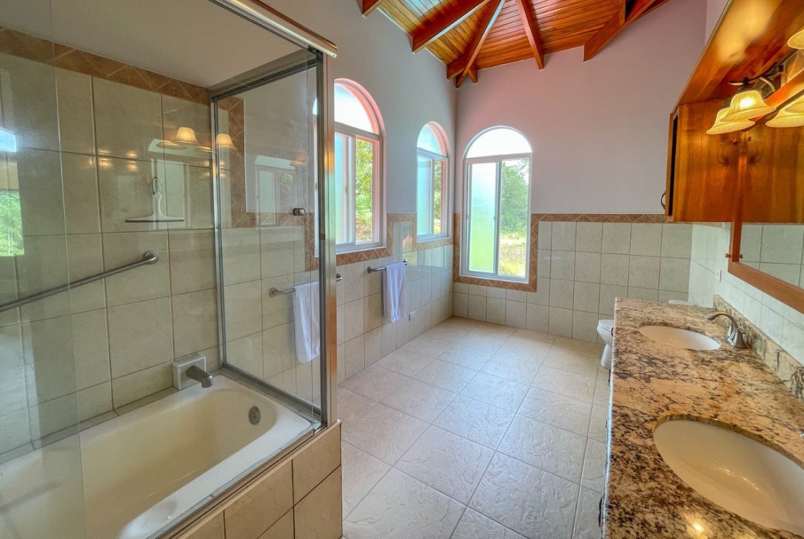 SOLID CONSTRUCTION HOME WITH BEAUFITUL JUNGLE VIEWS IN OJOCHAL – 0.36 ACRES