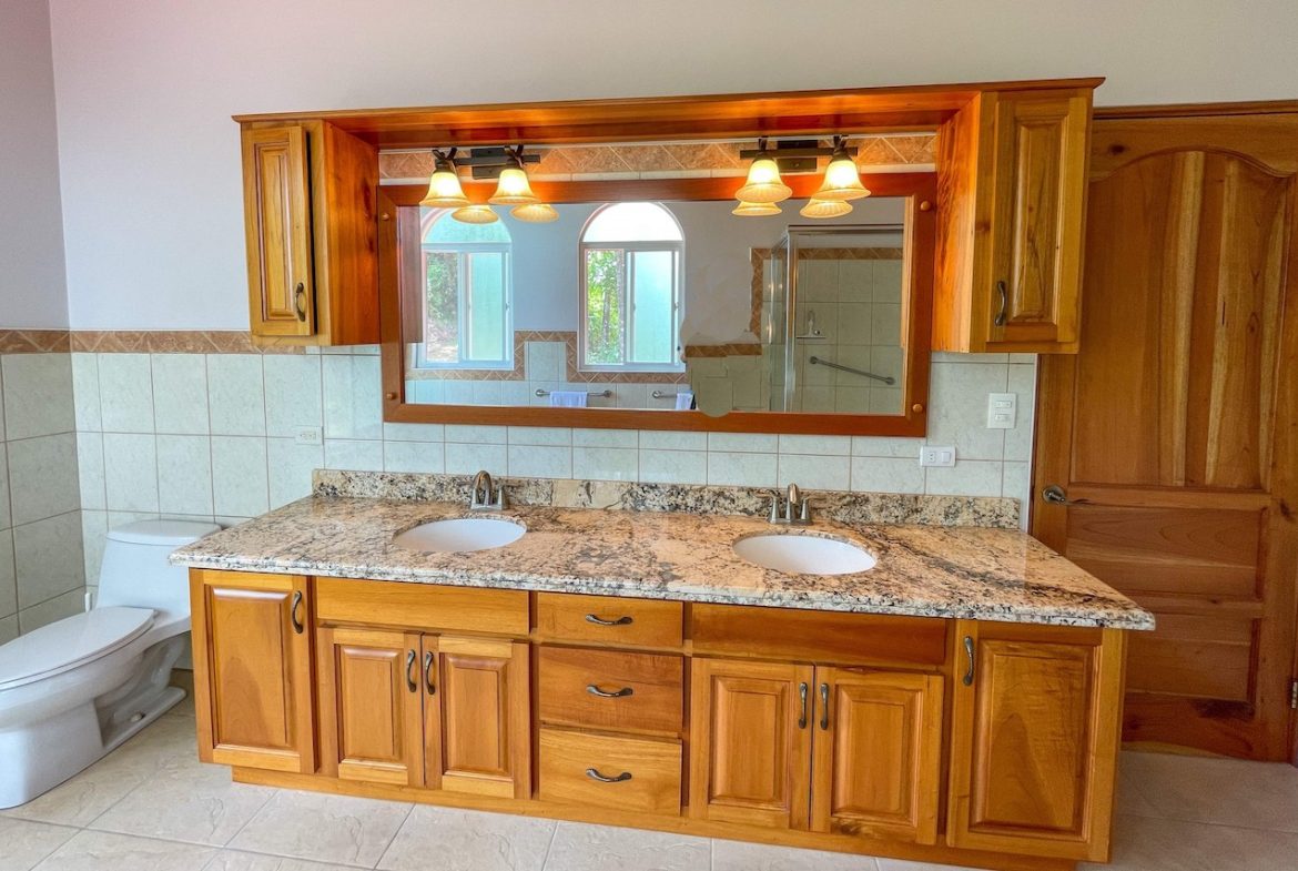 SOLID CONSTRUCTION HOME WITH BEAUFITUL JUNGLE VIEWS IN OJOCHAL – 0.36 ACRES
