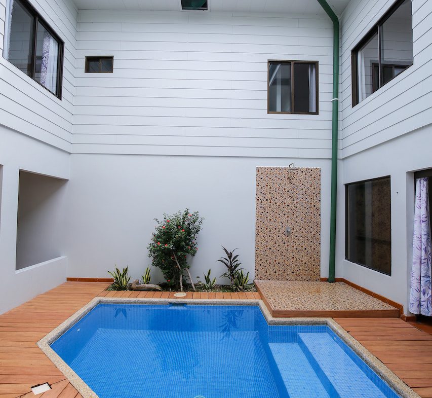 HOME AND APARTMENT WALKING DISTANCE TO THE BEACH – 1.3 ACRES