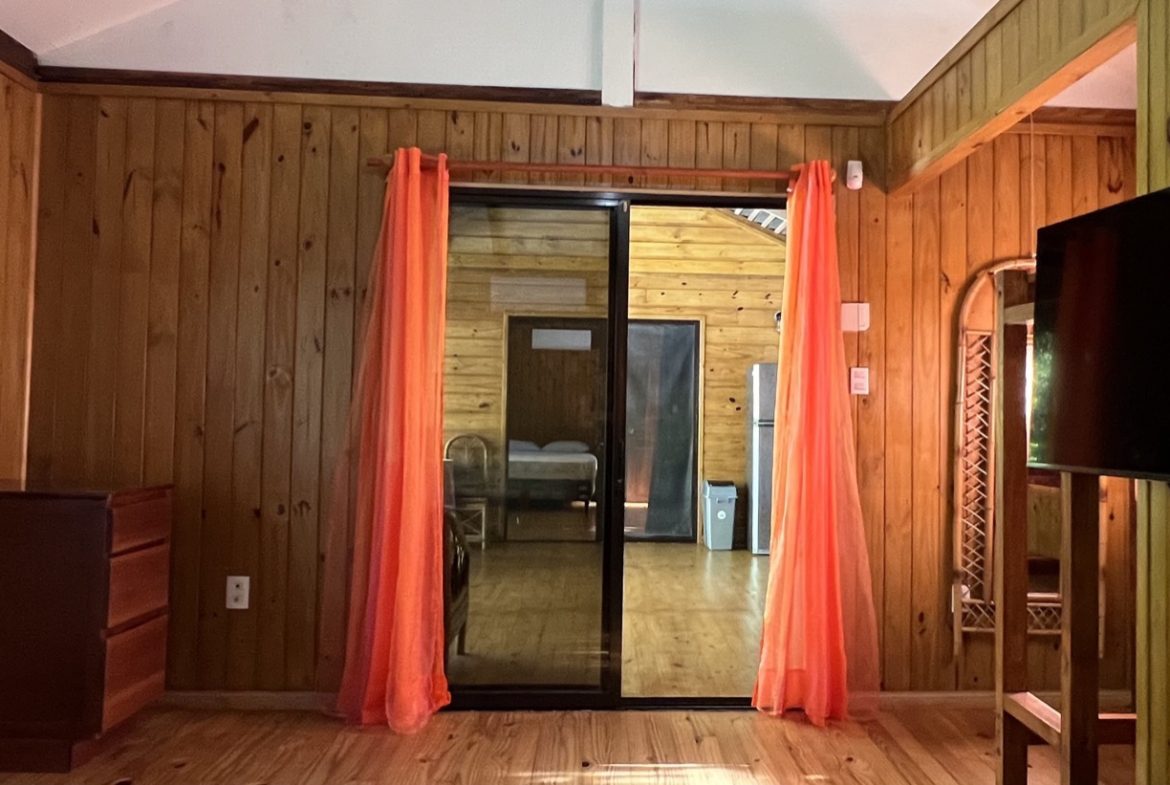 TROPICAL WOODEN STILT HOME IN OJOCHAL – RUSTIC CHARM & INVESTMENT POTENTIAL – 0.5 ACRES