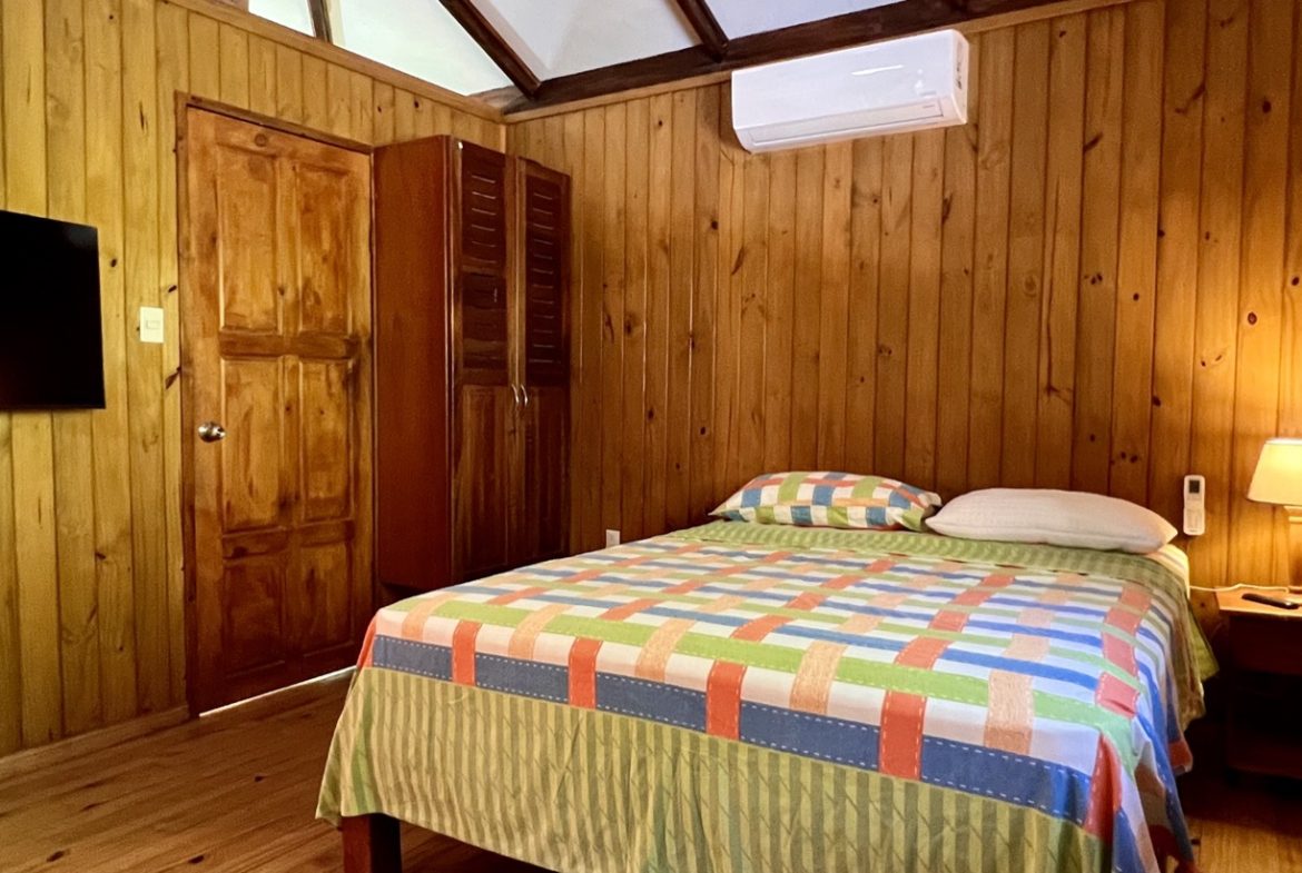 TROPICAL WOODEN STILT HOME IN OJOCHAL – RUSTIC CHARM & INVESTMENT POTENTIAL – 0.5 ACRES