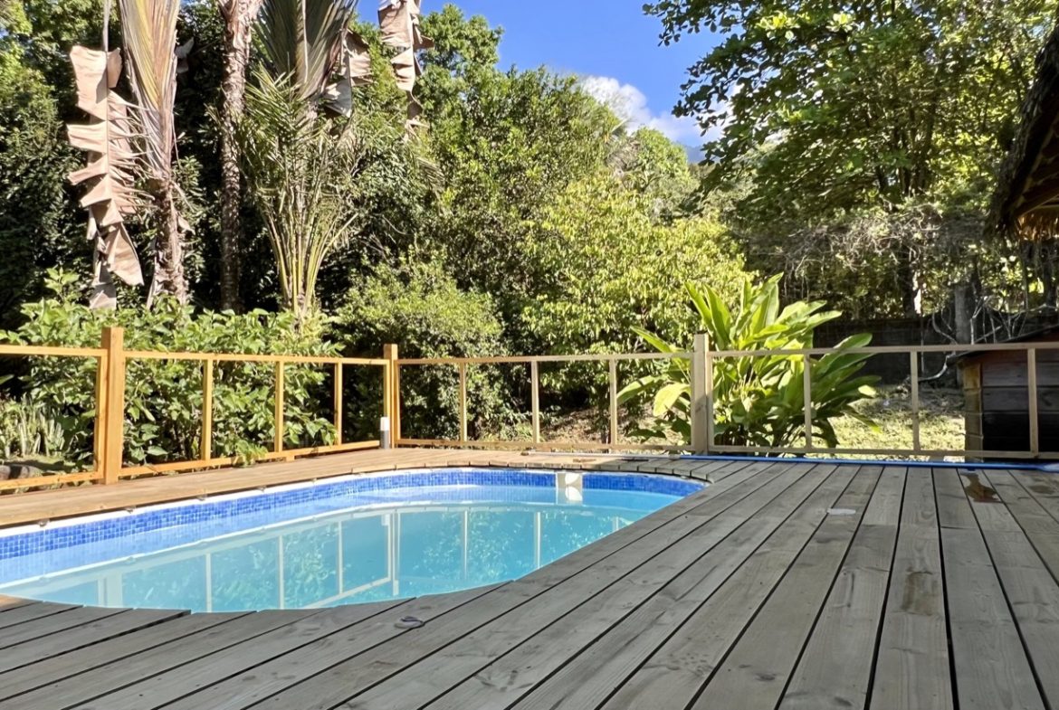 TROPICAL WOODEN STILT HOME IN OJOCHAL – RUSTIC CHARM & INVESTMENT POTENTIAL – 0.5 ACRES