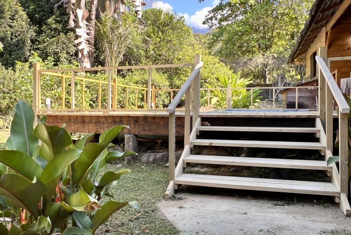TROPICAL WOODEN STILT HOME IN OJOCHAL – RUSTIC CHARM & INVESTMENT POTENTIAL – 0.5 ACRES