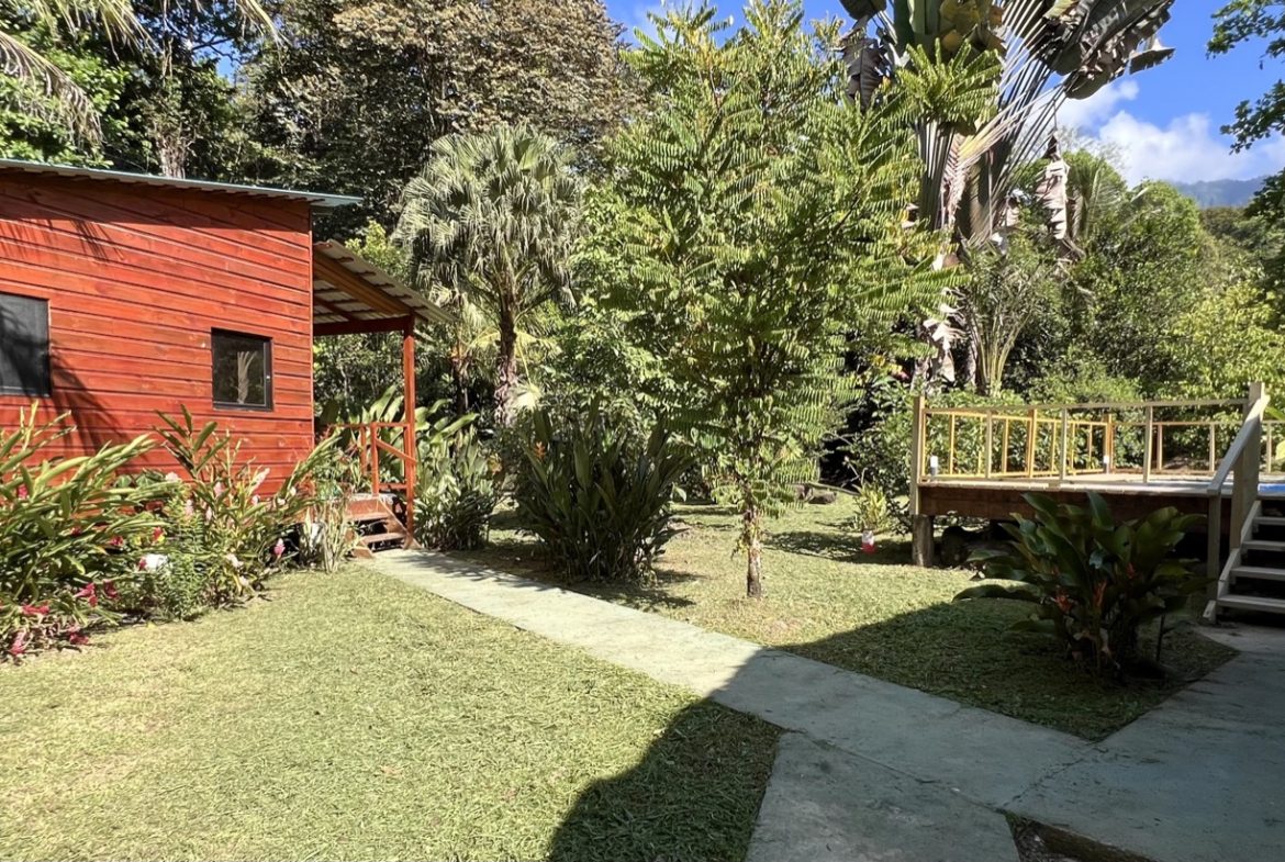 TROPICAL WOODEN STILT HOME IN OJOCHAL – RUSTIC CHARM & INVESTMENT POTENTIAL – 0.5 ACRES