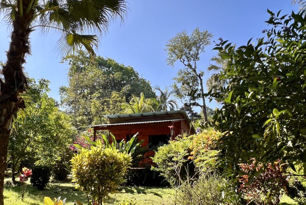 TROPICAL WOODEN STILT HOME IN OJOCHAL – RUSTIC CHARM & INVESTMENT POTENTIAL – 0.5 ACRES