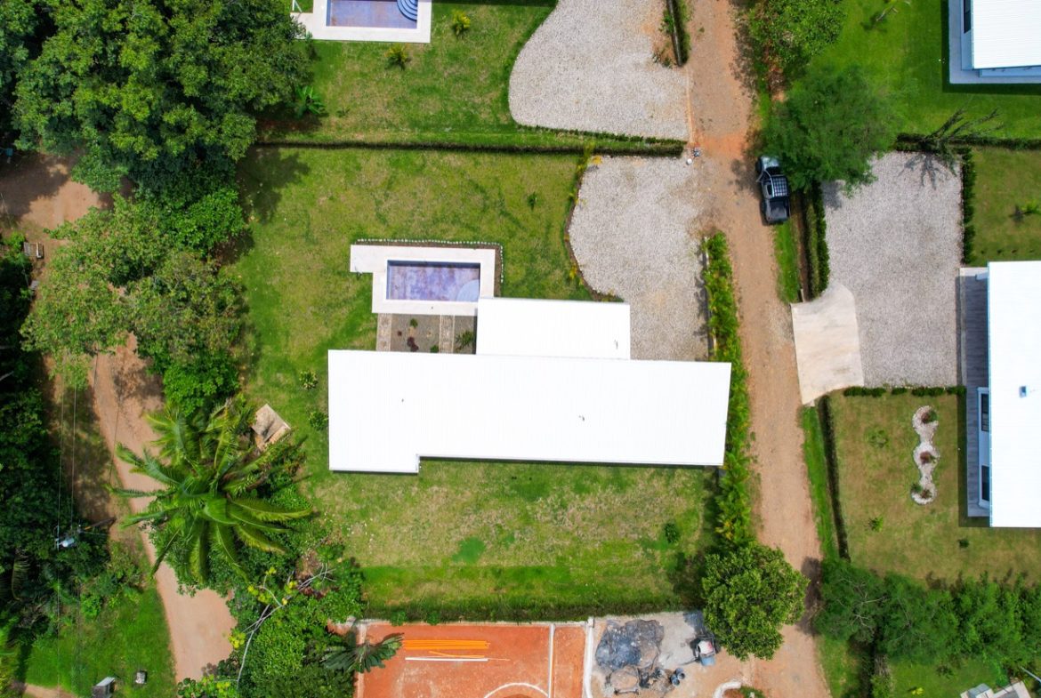 PROPERTY WITH THREE BEDROOM HOME IN A GATED COMMUNITY, IN OJOCHAL – 0.25 ACRES