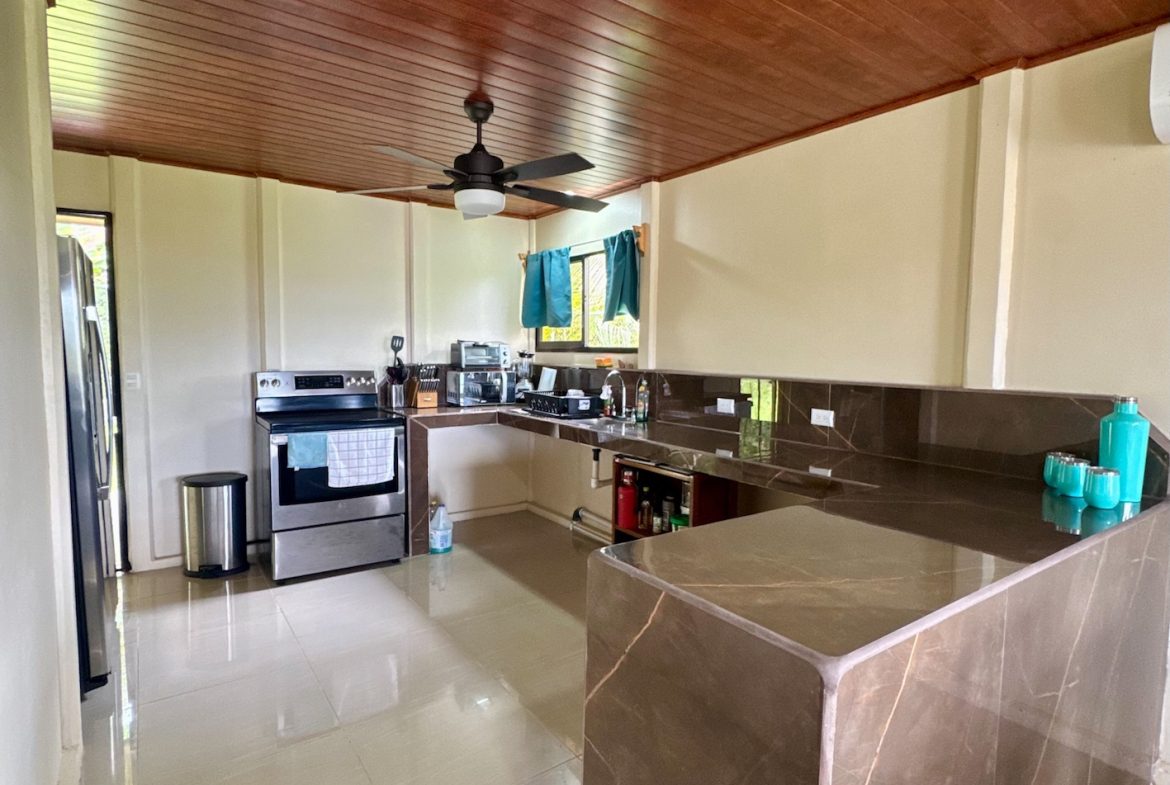 PROPERTY TWO BEDROOM HOME WITH LANDSCAPING VIEWS AND POOL, IN OJOCHAL – 0.22 ACRES, Uvita, Costa Rica — photo 7