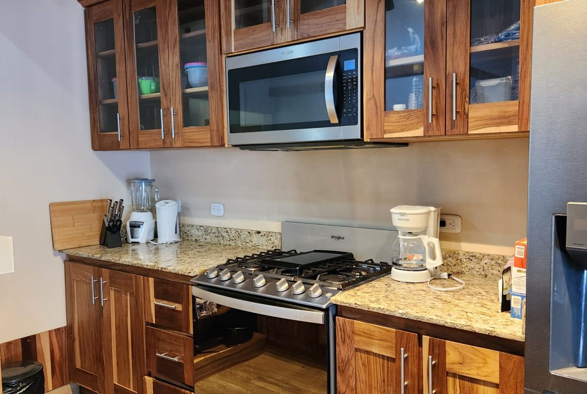 PRIVATE RIVERFRONT ESTATE WITH MAIN HOME, GUEST CABIN AND LUSH GROUNDS ON 0.68-ACRE
