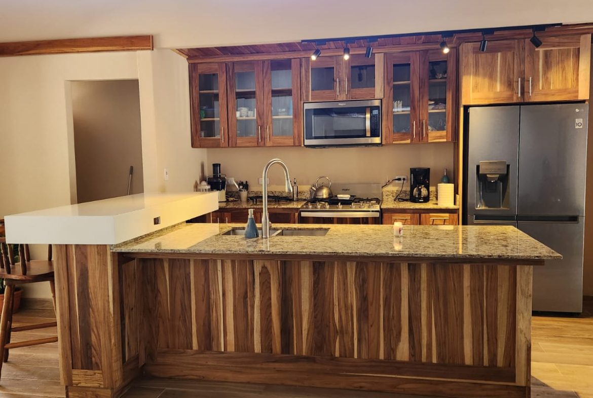 PRIVATE RIVERFRONT ESTATE WITH MAIN HOME, GUEST CABIN AND LUSH GROUNDS ON 0.68-ACRE