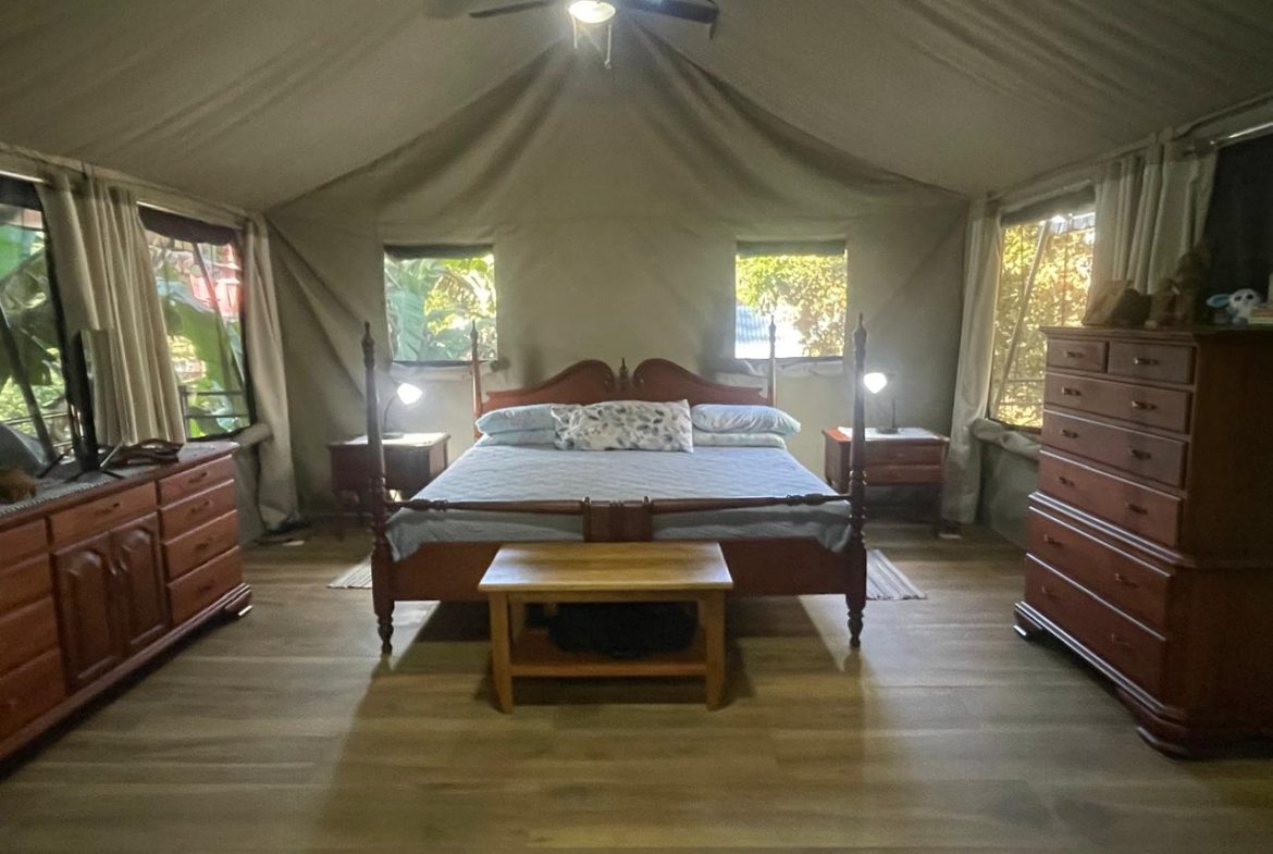PRIVATE RIVERFRONT ESTATE WITH MAIN HOME, GUEST CABIN AND LUSH GROUNDS ON 0.68-ACRE