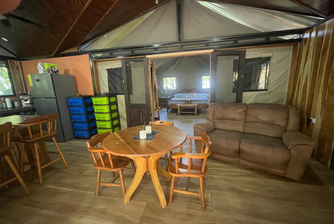 PRIVATE RIVERFRONT ESTATE WITH MAIN HOME, GUEST CABIN AND LUSH GROUNDS ON 0.68-ACRE