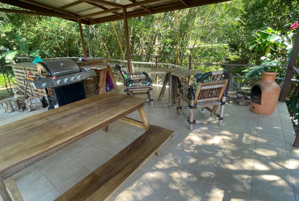 PRIVATE RIVERFRONT ESTATE WITH MAIN HOME, GUEST CABIN AND LUSH GROUNDS ON 0.68-ACRE