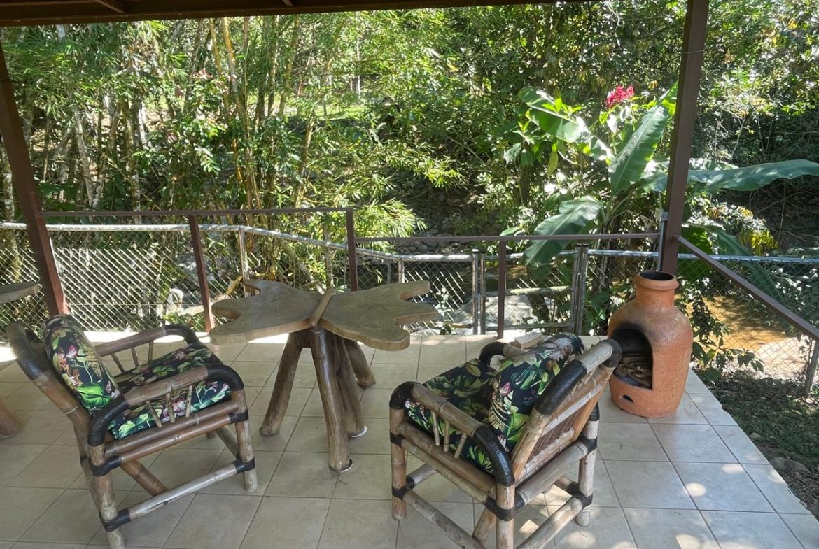 PRIVATE RIVERFRONT ESTATE WITH MAIN HOME, GUEST CABIN AND LUSH GROUNDS ON 0.68-ACRE