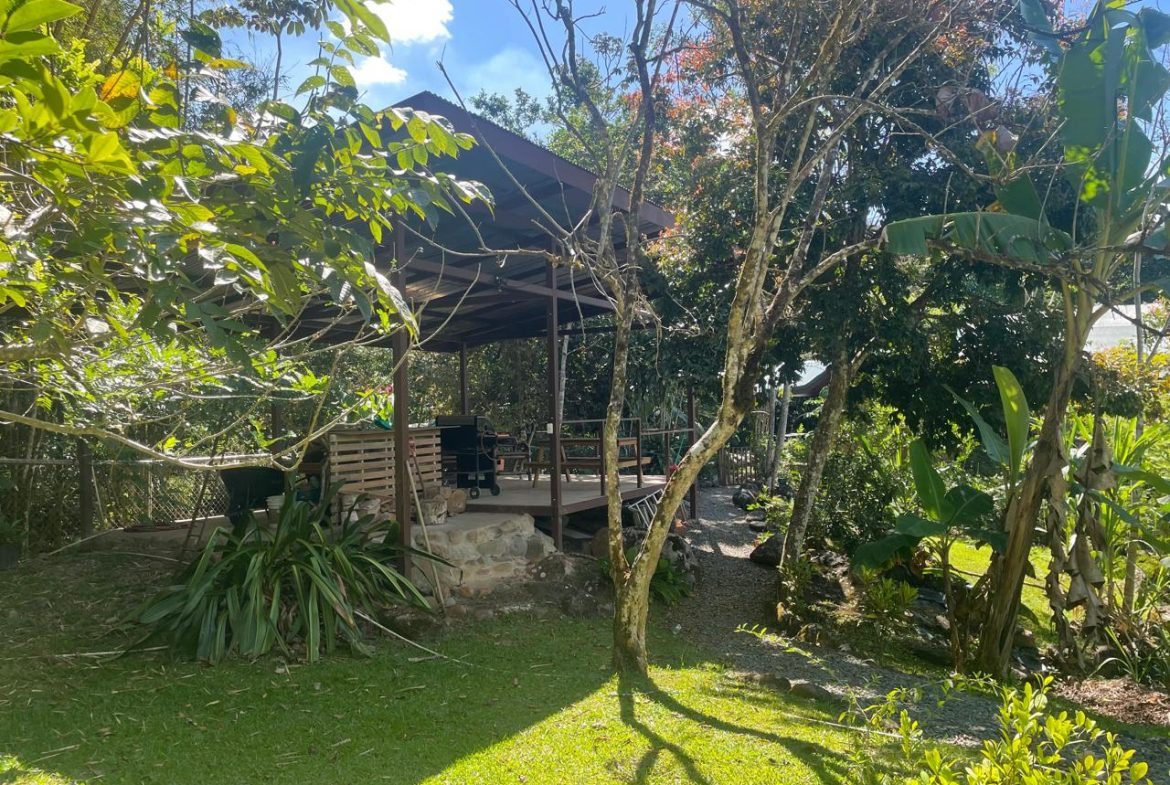 PRIVATE RIVERFRONT ESTATE WITH MAIN HOME, GUEST CABIN AND LUSH GROUNDS ON 0.68-ACRE
