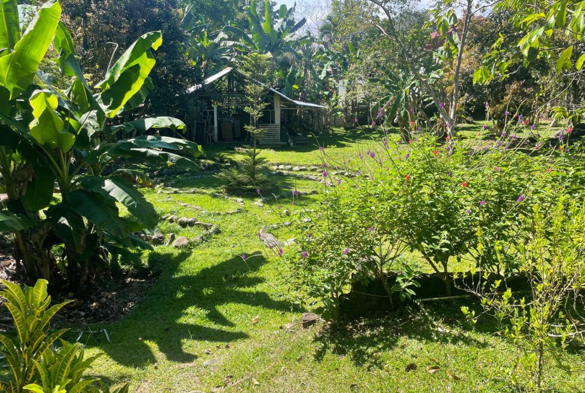 PRIVATE RIVERFRONT ESTATE WITH MAIN HOME, GUEST CABIN AND LUSH GROUNDS ON 0.68-ACRE