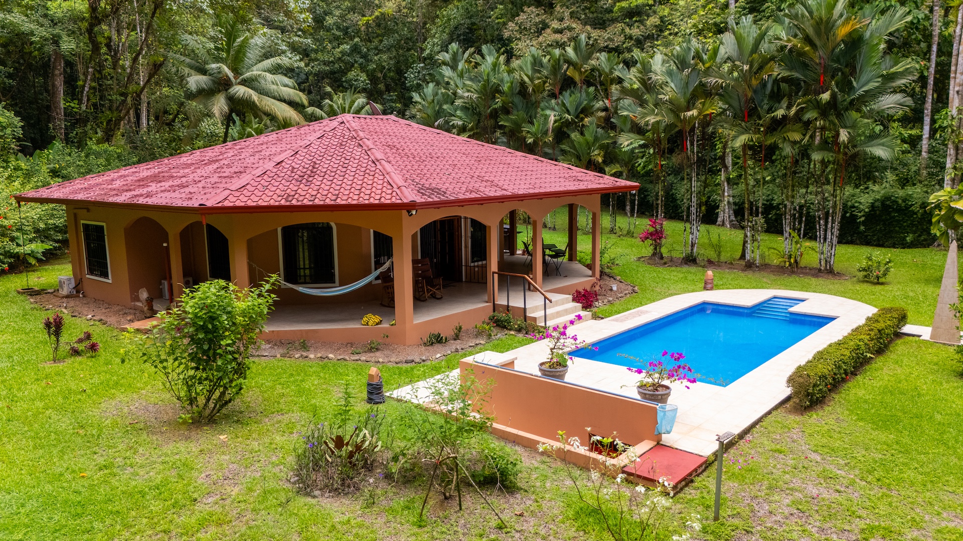 TROPICAL HOME WITH 2-BEDROOM POOL AND STREAM, IN OJOCHAL – 1.6 ACRES