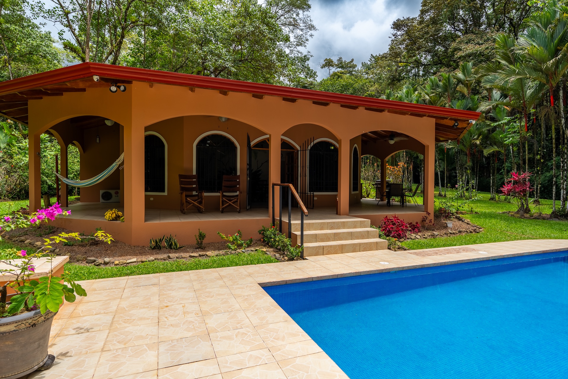 TROPICAL HOME WITH 2-BEDROOM POOL AND STREAM, IN OJOCHAL – 1.6 ACRES