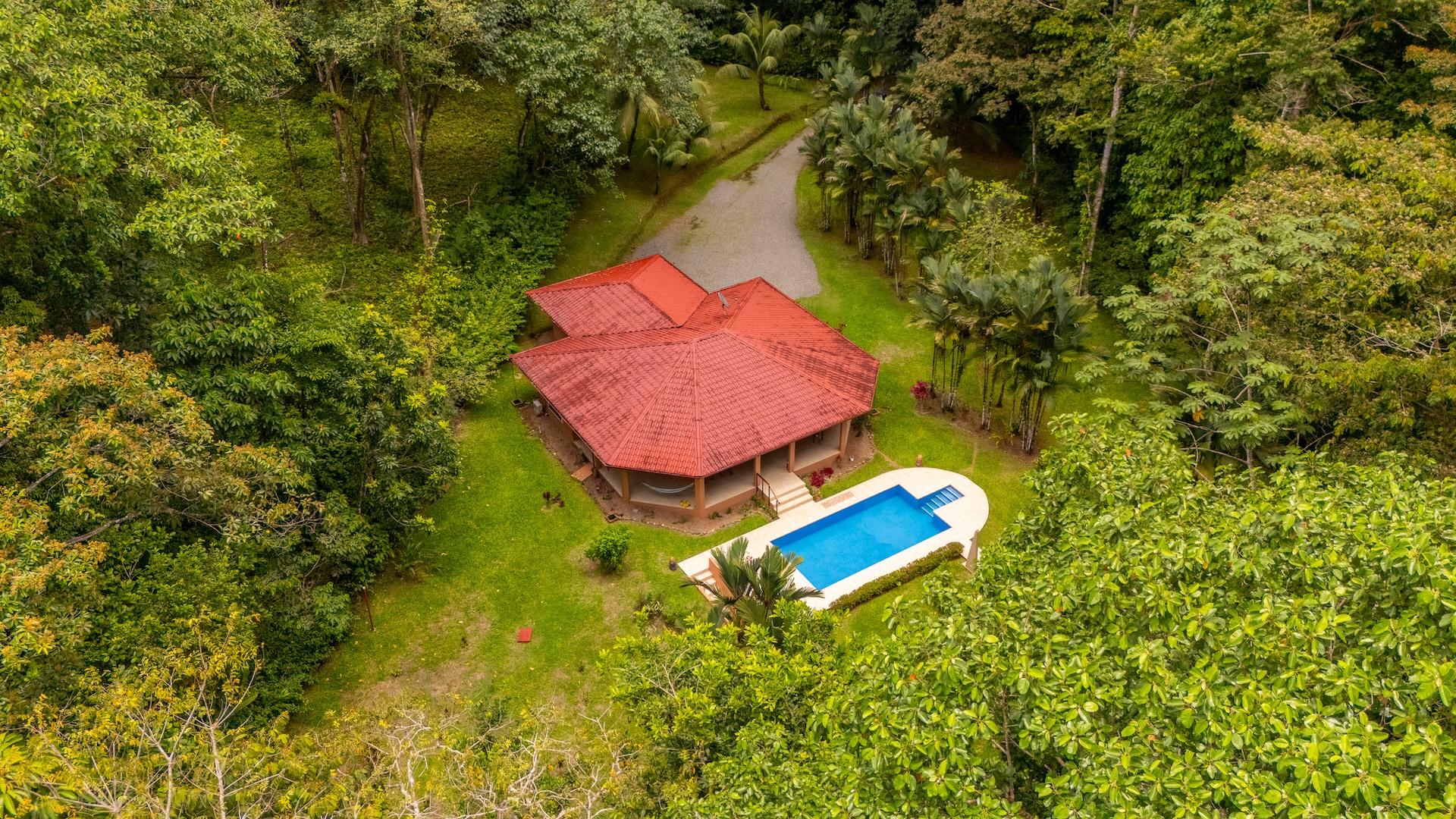 TROPICAL HOME WITH 2-BEDROOM POOL AND STREAM, IN OJOCHAL – 1.6 ACRES