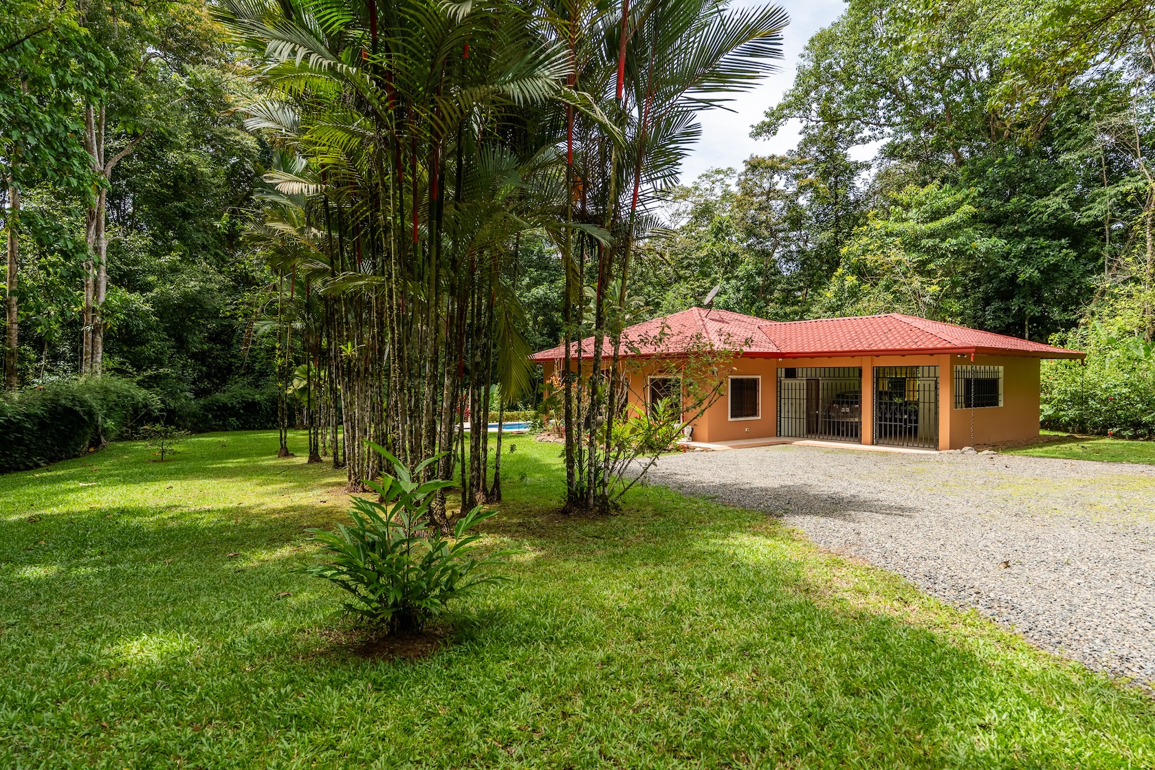 TROPICAL HOME WITH 2-BEDROOM POOL AND STREAM, IN OJOCHAL – 1.6 ACRES