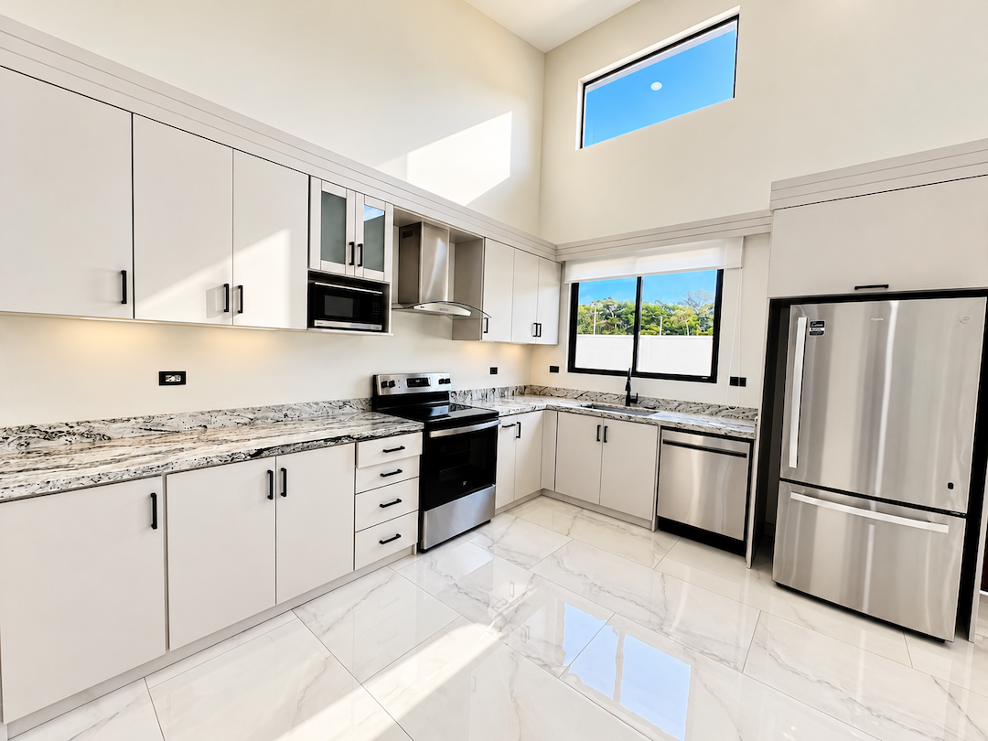 CONTEMPORARY 3-BEDROOM HOME WITH POOL AND TROPICAL GARDENS, IN UVITA – 0.11 ACRES