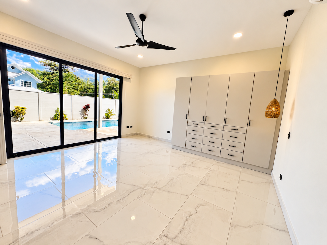CONTEMPORARY 3-BEDROOM HOME WITH POOL AND TROPICAL GARDENS, IN UVITA – 0.11 ACRES