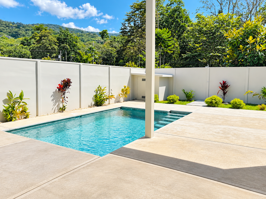 CONTEMPORARY 3-BEDROOM HOME WITH POOL AND TROPICAL GARDENS, IN UVITA – 0.11 ACRES